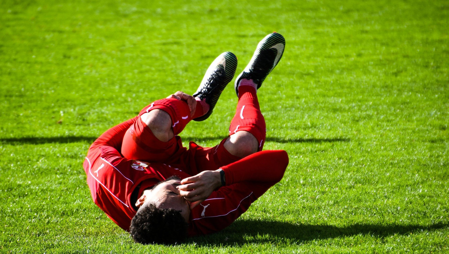 Football player with knee injury